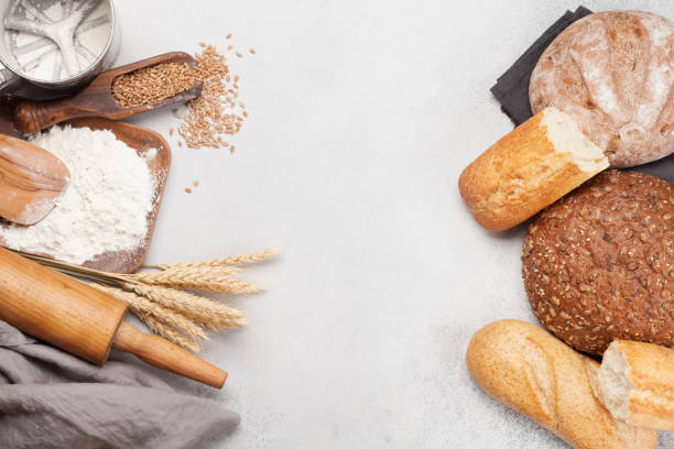 istock Various bread with wheat, flour and cooking utensils 1256054061