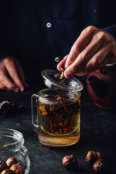 istock Steeping red tea in glass mug 1256055551