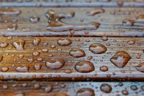 istock Background of water drops on a wooden surface 1256056134