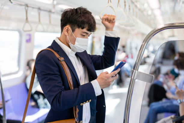 istock man with mask in metro 1256057526