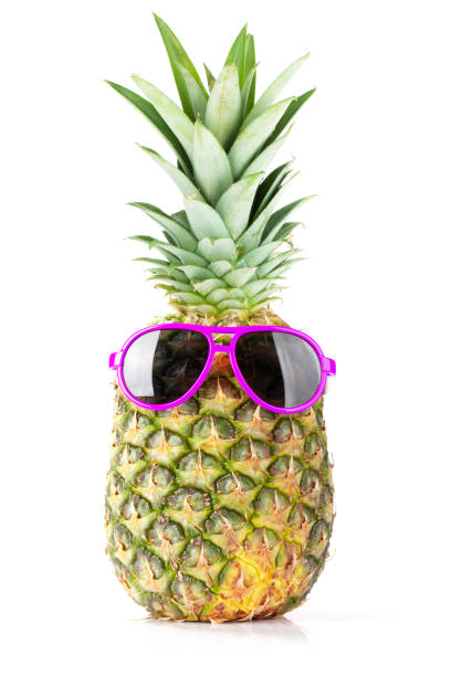 istock Ripe pineapple with sunglasses 1256057625