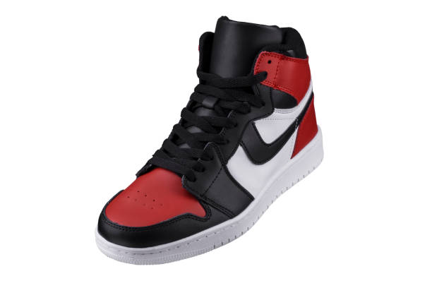 istock Side view of a high sneaker with red and black accents. 1256059233