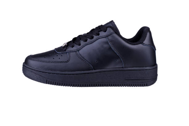 istock One black sneaker on a white background. Sport shoes. 1256063513