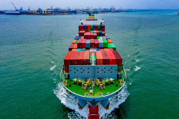 istock Cargo ships carrying full containers leaving the deep-sea port. 1256066076
