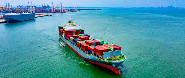 istock Cargo ships carrying full containers leaving the deep-sea port. 1256066077