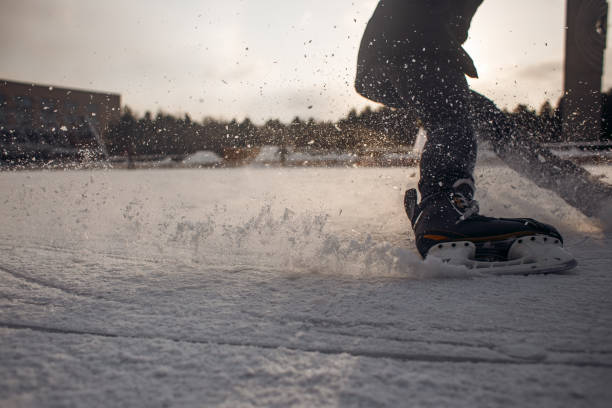 istock ice hockey player in action kicking with stick 1256066259