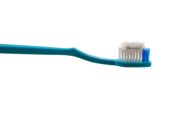 istock Blue toothbrush with toothpaste isolated on white background. 1256068861