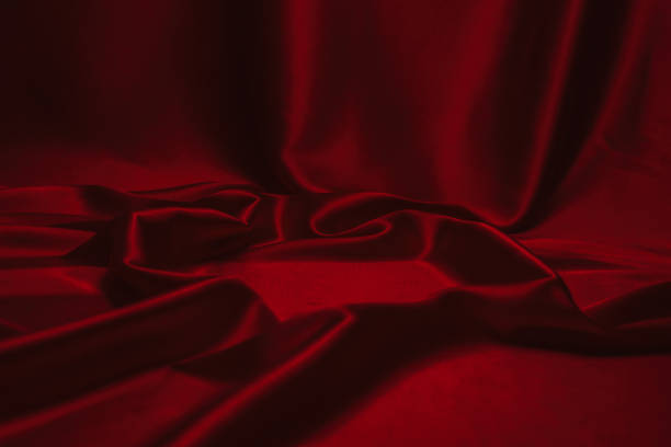 istock Red silk or satin luxury fabric texture can use as abstract background. 1256068899