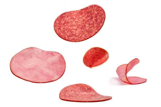 istock Falling tasty salami isolated on white 1256068913