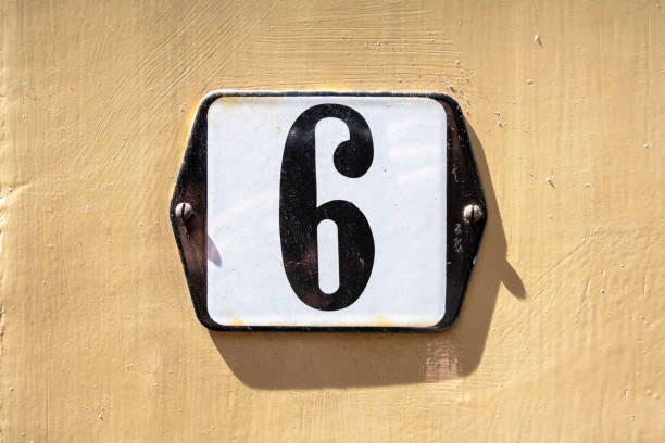 istock Number 6 in white on a black metal plate 1256071528