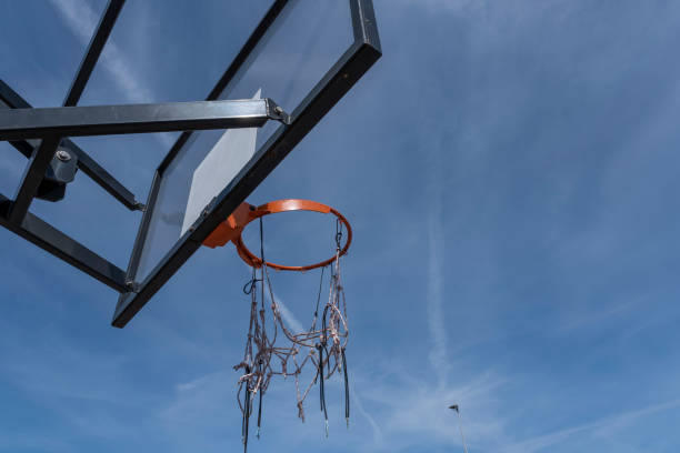 istock basketball hoop with a red ring against a cloudless warm summer sky 1256071615