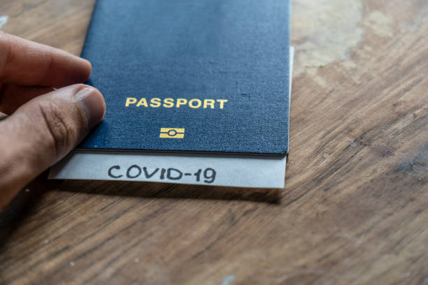 istock Passport with a diagnosis of covid 19 1256072144