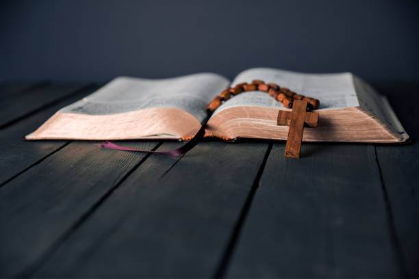 istock wooden cross on Bible 1256073122
