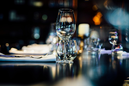 Luxury table settings for fine dining with and glassware, beautiful blurred  background. For events, weddings.  props for weddings, birthdays, and celebration. Wedding, restaurant,