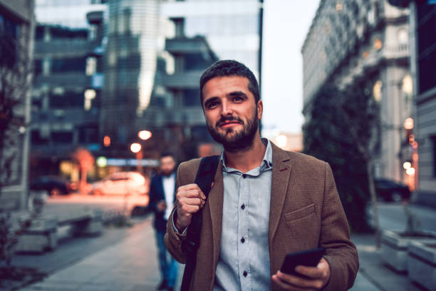 istock Elegant Male Using GPS To Take A Walk Around New City 1256074405