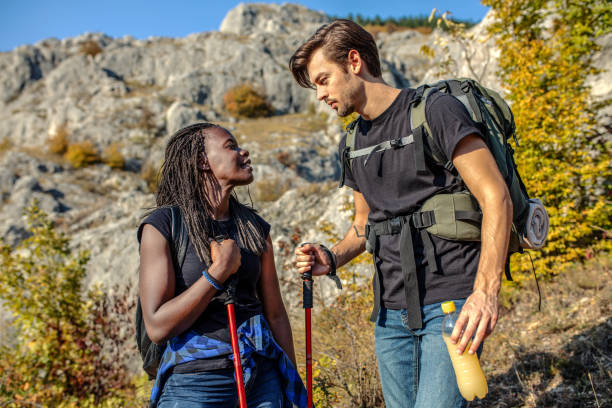 istock Friends hiking together on the mountains 1256074543