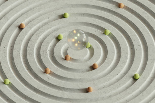 istock Rings are cut into the floor and small colored balls roll along them 1256074680