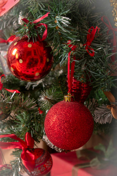istock red Christmas balls on a decorated Christmas tree close up 1256078992