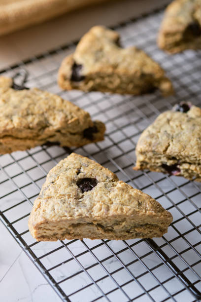 istock Triangle blueberry scones. a Traditional British baked good. set on cafe table. 1256084357