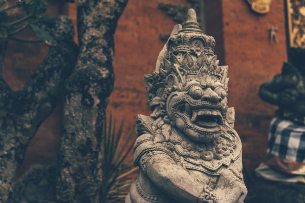 Stone Statue Of An Ancient Deity. Bali stone carving.