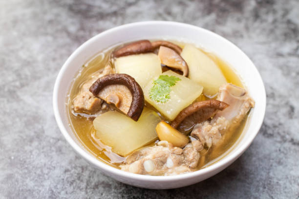 Winter melon soup with pork rib and shiitake mushroom with herbs (Thai clear soup with vegetable). stock photo