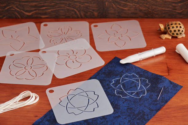 istock Preparing for Japanese embroidery sashiko. Templates, threads, tailor chalk pen with applicator. 1256095337
