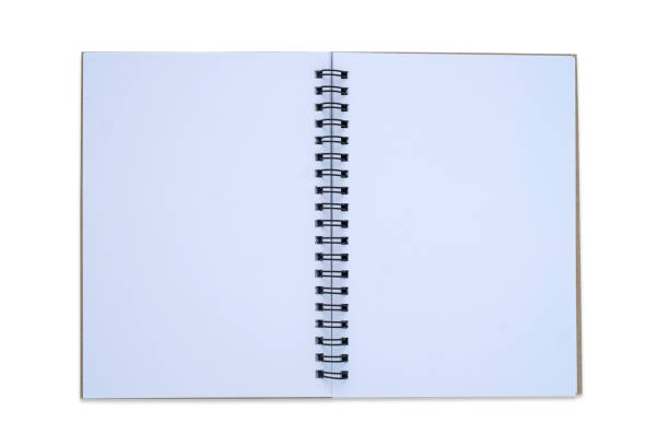 istock Top view, from above of open spiral blank page notebook isolated on white background for design a mockup. Education and business concept. flat lay 1256095414