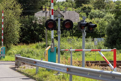 Railroad crossing in the suburbs. Summer. Day.