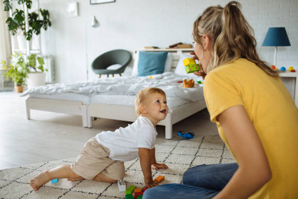 istock Mother and son playing with construction toys 1256097548