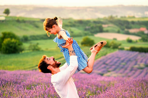 istock Father and daughter have fun in lavender field 1256098148