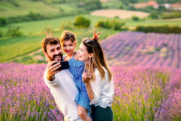 istock Happy family in lavender field 1256098331