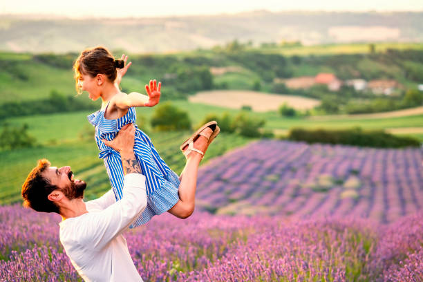 istock Father and daughter have fun in lavender field 1256099053