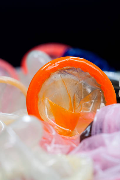 istock a whole orange latex condom 1256101120