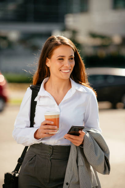 istock Young businesswoman on coffee break using phone. 1256102490
