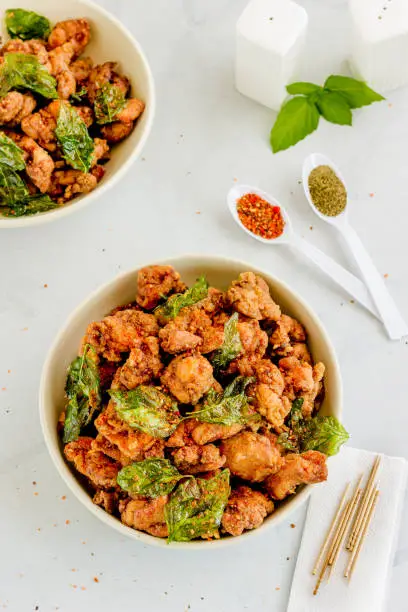 Taiwanese Deep Fried Chicken with Basil Leaves, Spices and Seasonings Top Down Street Food Vertical Photo