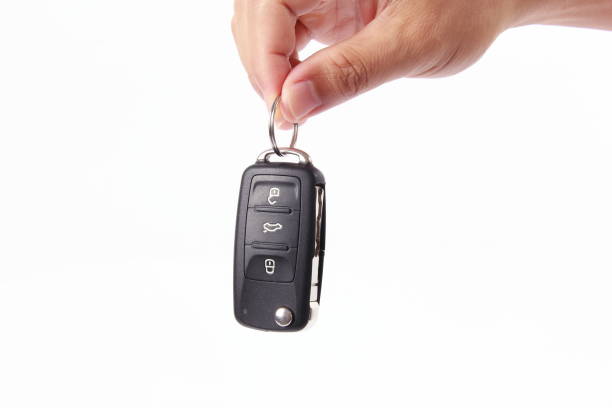 Gray key to the car on white surface. Isolated. 3D Illustration