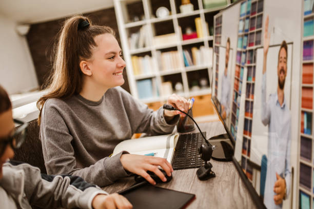istock Boy and girl studies at home and doing school homework. Distance learning online education. 1256104002