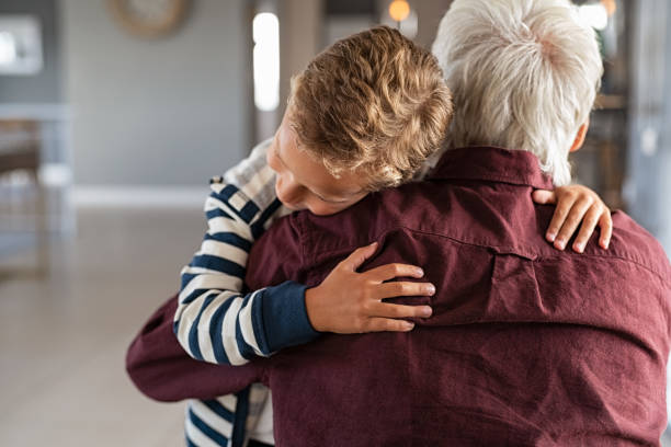 istock Attached child hugging his grandfather 1256104103