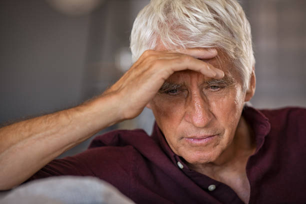 istock Stressed and upset senior man at home 1256105624