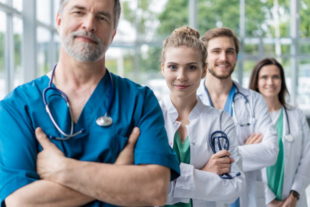 doctor leading a medical team at the hospital. - médico geral imagens e fotografias de stock