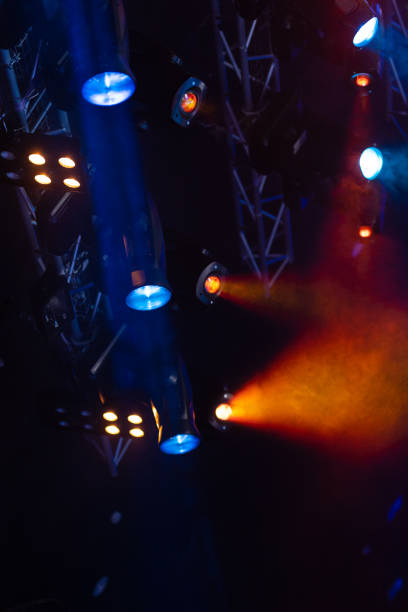 istock lights spotlights and smoke over the stage 1256107027
