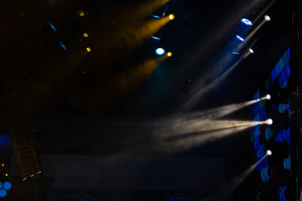 istock lights spotlights and smoke over the stage 1256107066