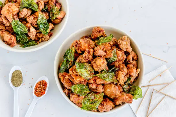 Taiwanese Fried Chicken with Basil Leaves, Spices and Seasonings Top Down Street Food Photo