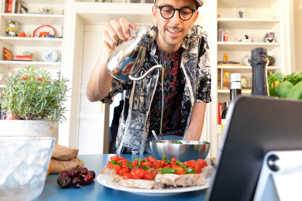 Happy Man Cooking - Preparing Bruschetta Bread