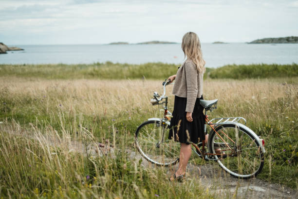 istock Young woman overlooking ocean. 1256108485