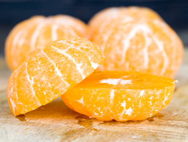 istock peeled orange juicy tangerine 1256108956