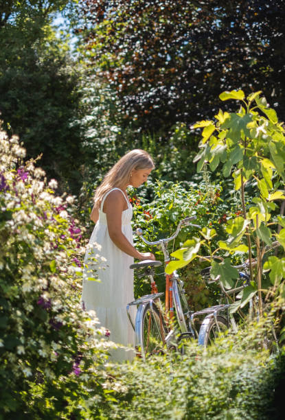 istock Young woman with vintage bicycle. 1256109843