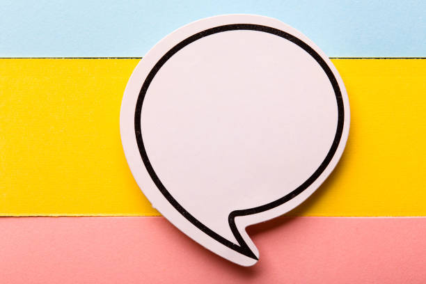 istock Blank Speech Bubble Paper Isolated On Colorful Background 1256112257