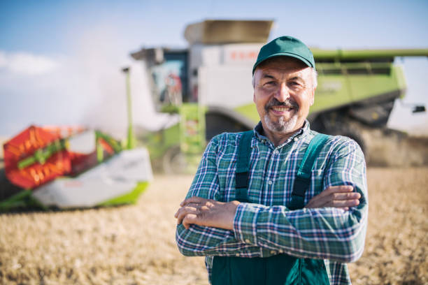 istock Portrait Of Confident Smiling Combine Driver. 1256112300
