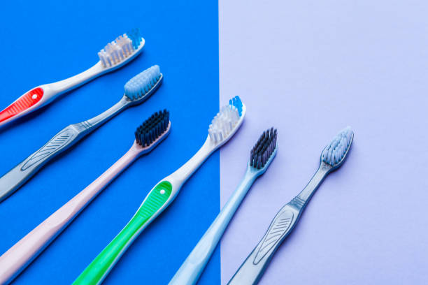 istock Flat lay composition with manual toothbrushes on color background, close up 1256112931